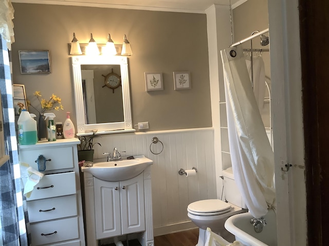 full bathroom featuring vanity, toilet, wood-type flooring, and shower / bath combo