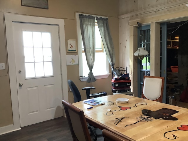 dining area with dark wood-type flooring