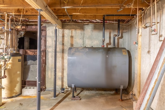 unfinished below grade area featuring gas water heater and heating fuel