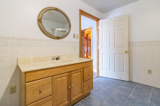 bathroom featuring vanity, tile walls, and tile patterned floors