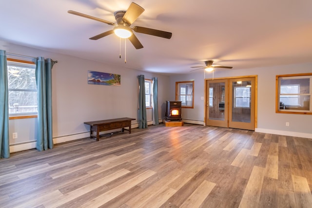 interior space featuring baseboard heating and light wood-type flooring