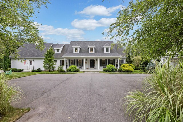 cape cod home with covered porch