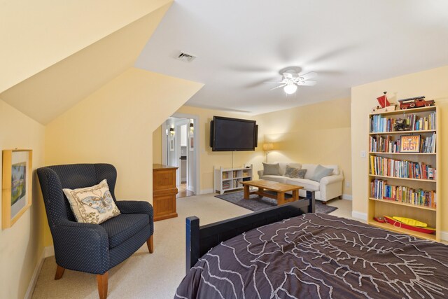 carpeted bedroom featuring lofted ceiling and ceiling fan