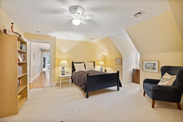 carpeted bedroom featuring lofted ceiling and ceiling fan