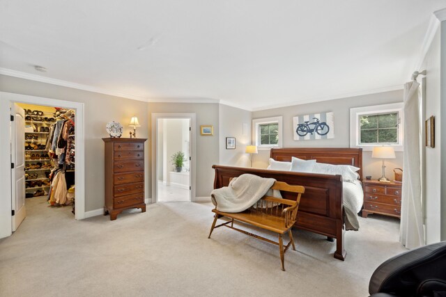 carpeted bedroom with a spacious closet, crown molding, a closet, and multiple windows