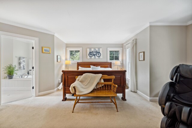 bedroom with ornamental molding and light colored carpet