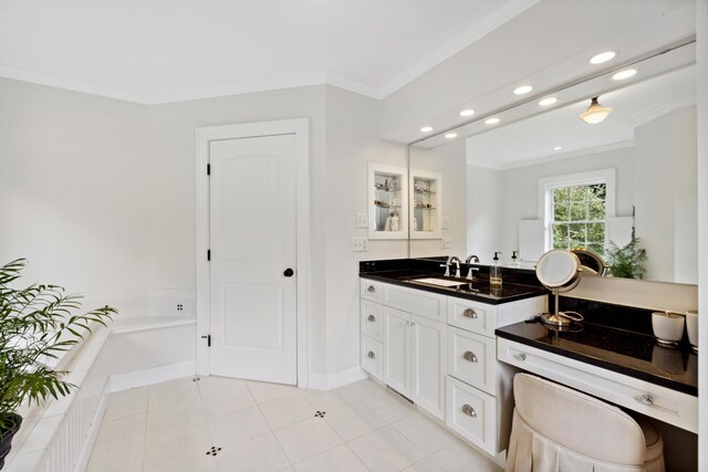 bathroom featuring ornamental molding, vanity, tile patterned floors, and a bath