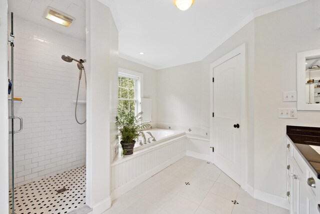 bathroom featuring tile patterned floors, vanity, separate shower and tub, and ornamental molding