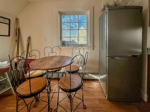 30 Ocean Ave, Kennebunkport, ME 04046 - dining area with wood finished floors and vaulted ceiling