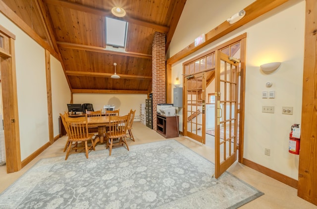 dining room featuring lofted ceiling with beams, ceiling fan, wood ceiling, and french doors