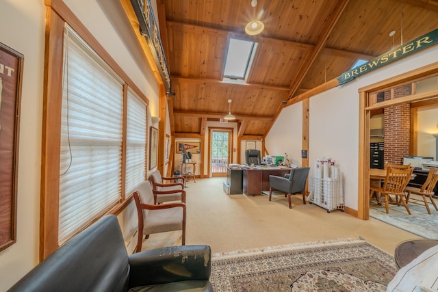 carpeted home office featuring vaulted ceiling with skylight and wood ceiling