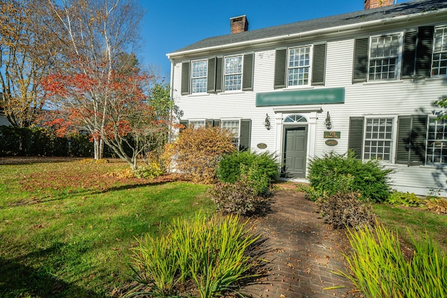 colonial inspired home with a front yard