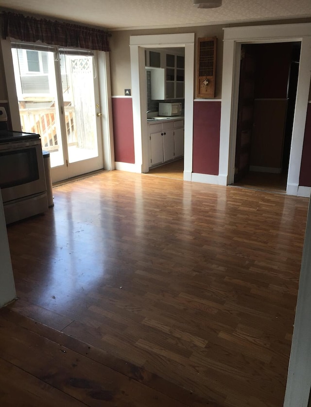 76 E Main St, Fort Kent, ME 04743 - unfurnished living room featuring wood finished floors