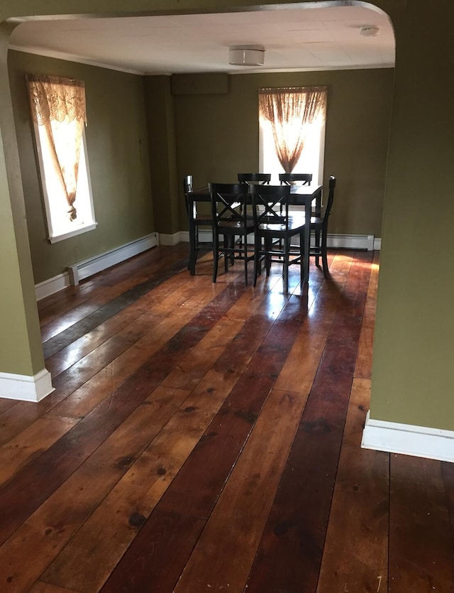 76 E Main St, Fort Kent, ME 04743 - dining area featuring baseboards, a baseboard heating unit, and dark wood finished floors