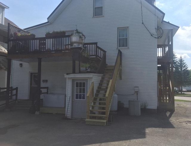 76 E Main St, Fort Kent, ME 04743 - back of house featuring stairway and a wooden deck