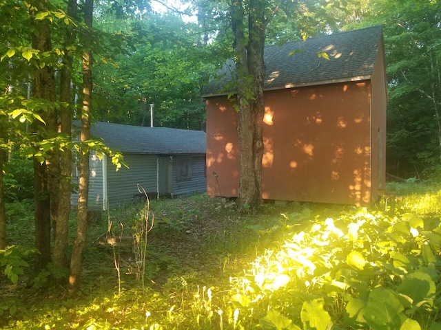 exterior space featuring a shed