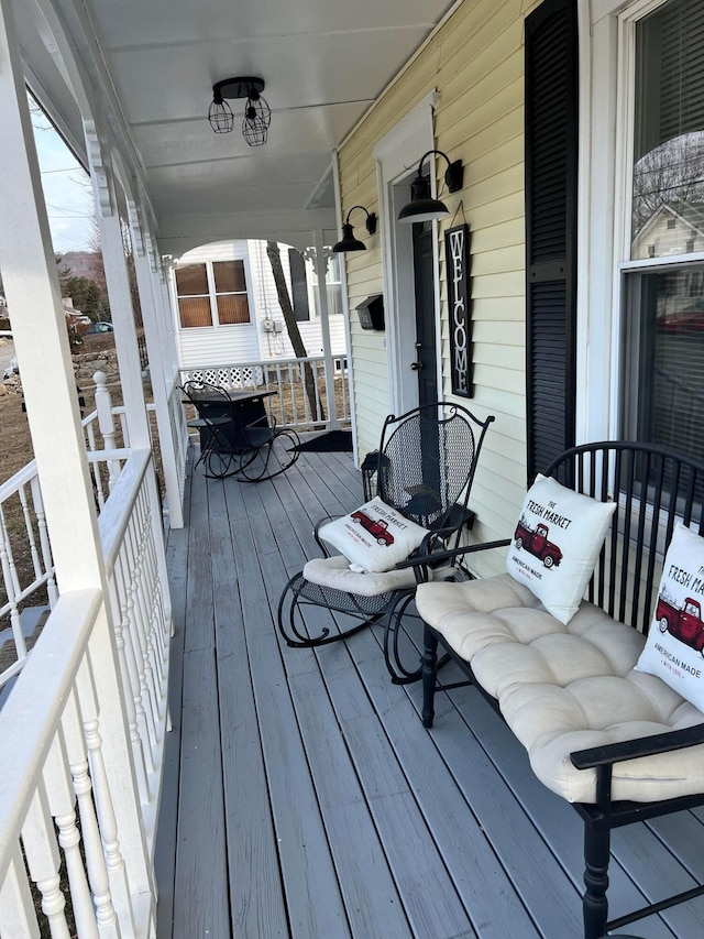 wooden terrace featuring a porch