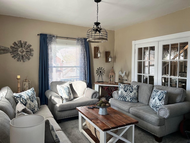 living room with dark colored carpet