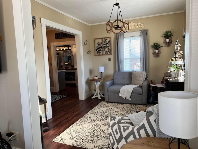 living room featuring an inviting chandelier, dark wood-type flooring, and crown molding