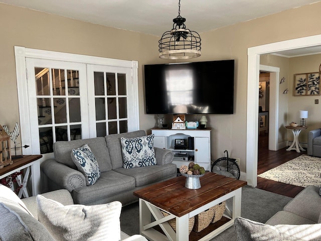 living room featuring a notable chandelier and hardwood / wood-style floors