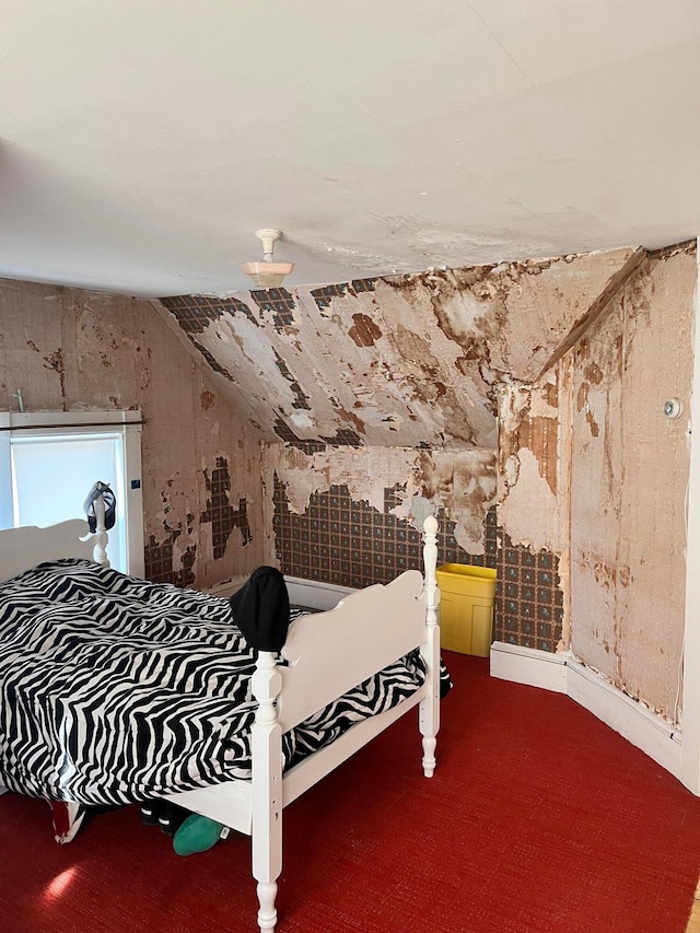 bedroom with vaulted ceiling and carpet flooring