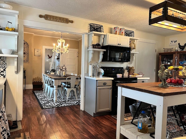 kitchen with a textured ceiling, black appliances, dark hardwood / wood-style flooring, hanging light fixtures, and gray cabinetry