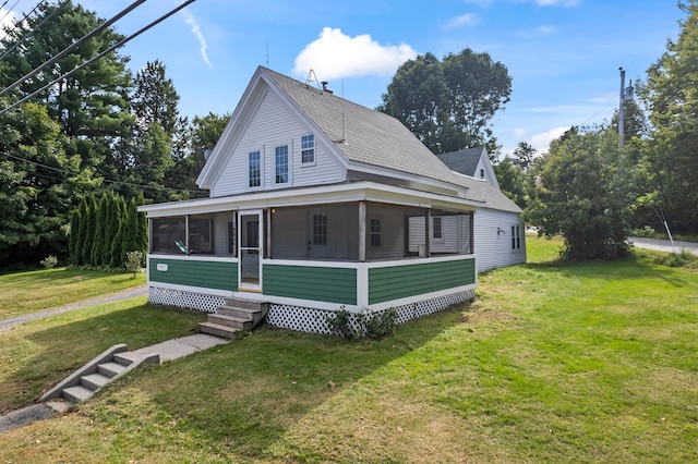 country-style home with a sunroom and a front yard