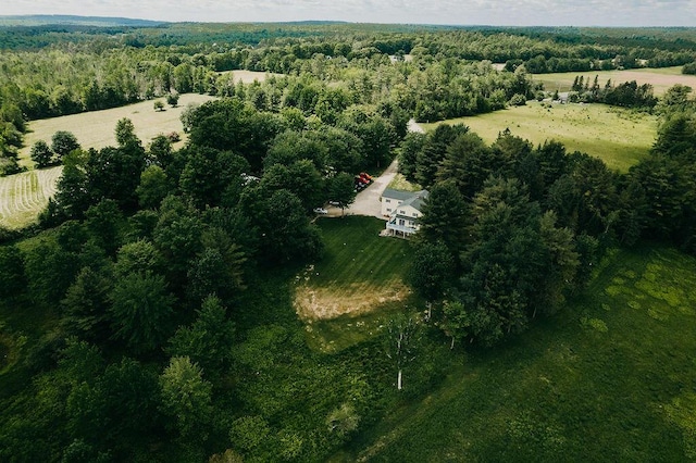 birds eye view of property with a rural view