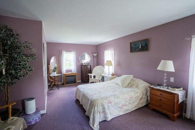 bedroom featuring dark carpet