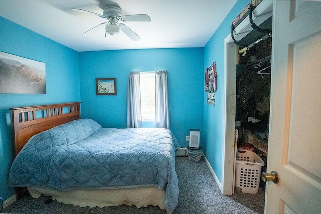 carpeted bedroom featuring ceiling fan and a closet