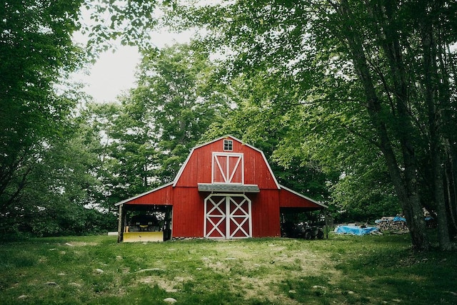 view of outdoor structure featuring a lawn