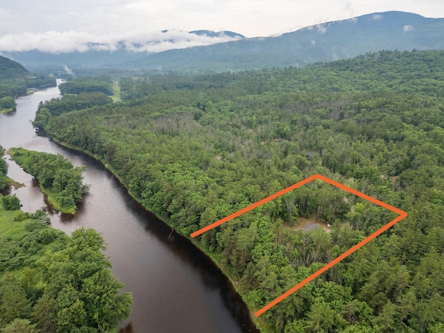 drone / aerial view with a water and mountain view