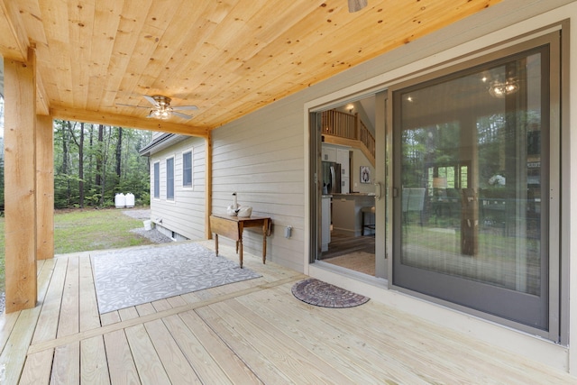 wooden deck with ceiling fan