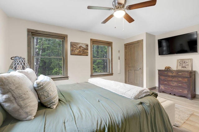 bedroom featuring ceiling fan and light hardwood / wood-style flooring