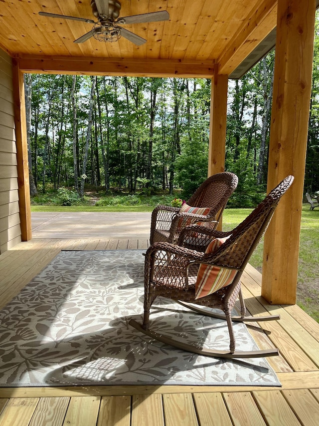 sunroom / solarium with ceiling fan and wooden ceiling