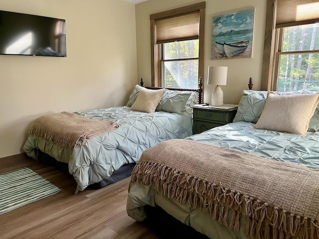 bedroom with light wood-type flooring