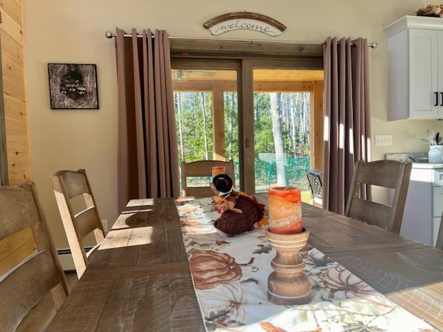 dining area with a baseboard heating unit