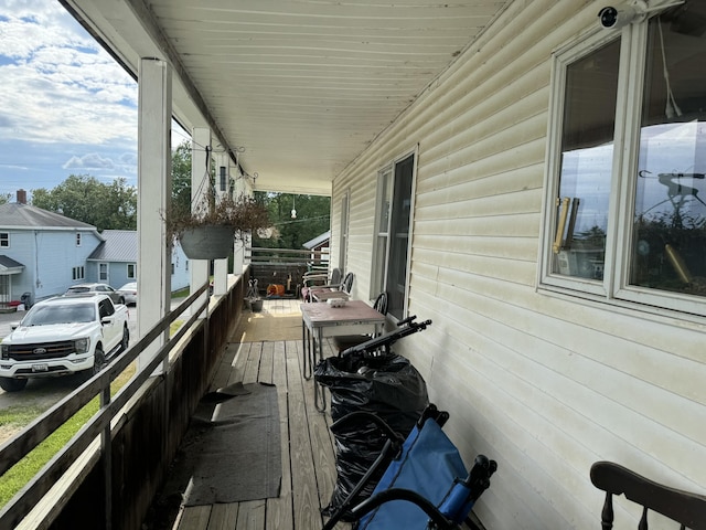 wooden terrace featuring a porch