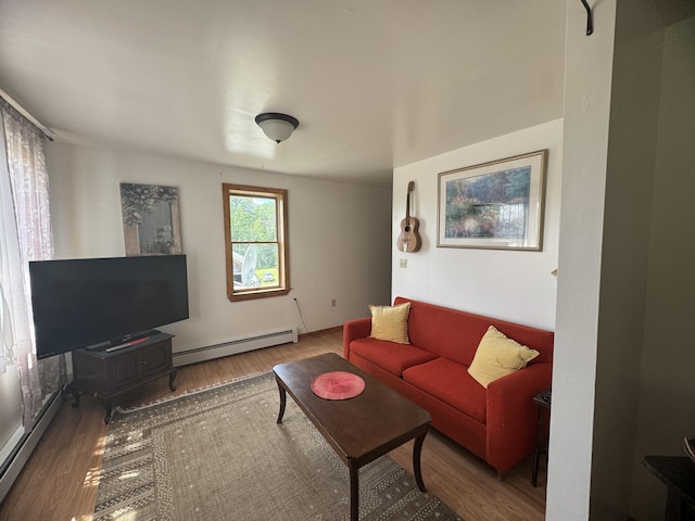 living room featuring a baseboard heating unit and wood-type flooring