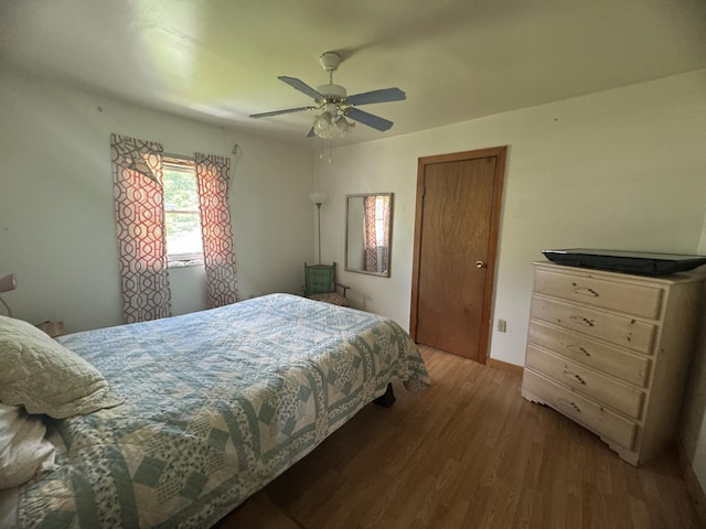 bedroom featuring ceiling fan and wood-type flooring