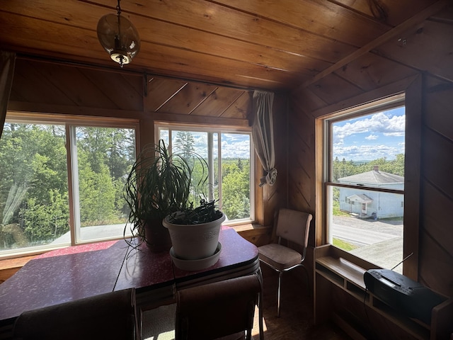 sunroom featuring wood ceiling