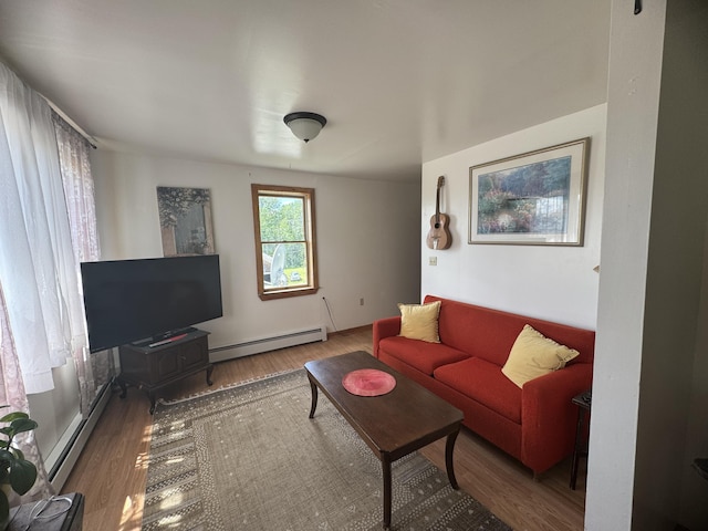 living room with baseboard heating and dark wood-type flooring