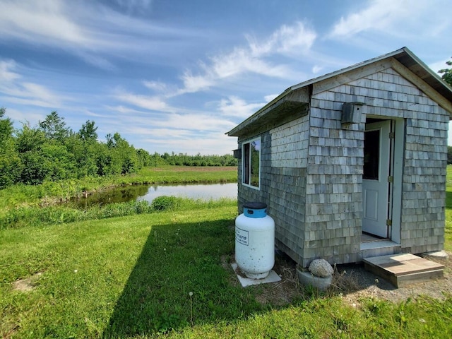 exterior space with a yard and a water view