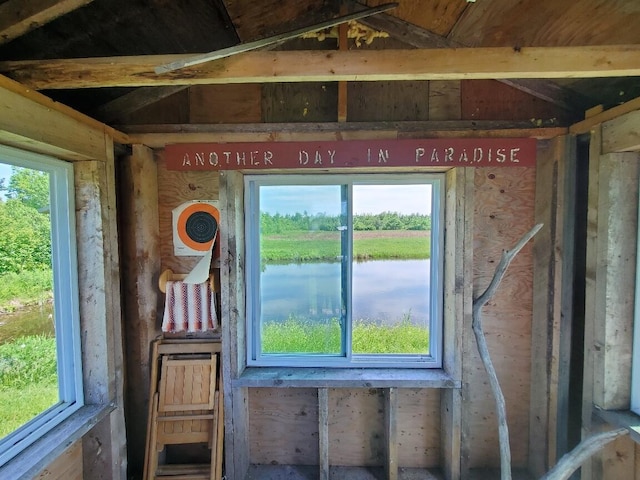 miscellaneous room with a healthy amount of sunlight and a water view