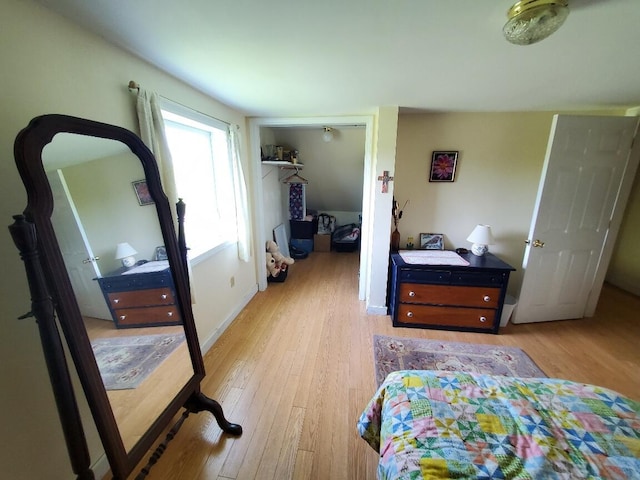 bedroom featuring light hardwood / wood-style floors and a closet