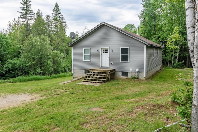 back of house featuring a yard