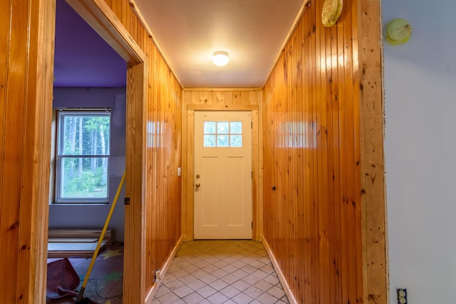 entryway featuring wood walls