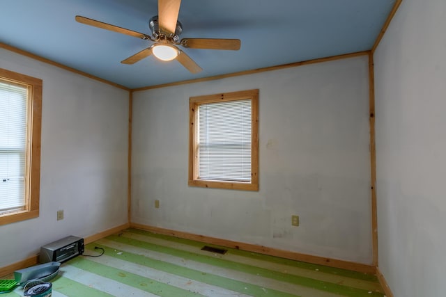 empty room featuring ceiling fan