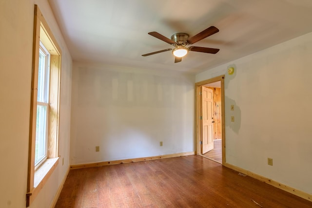 spare room featuring hardwood / wood-style floors and ceiling fan