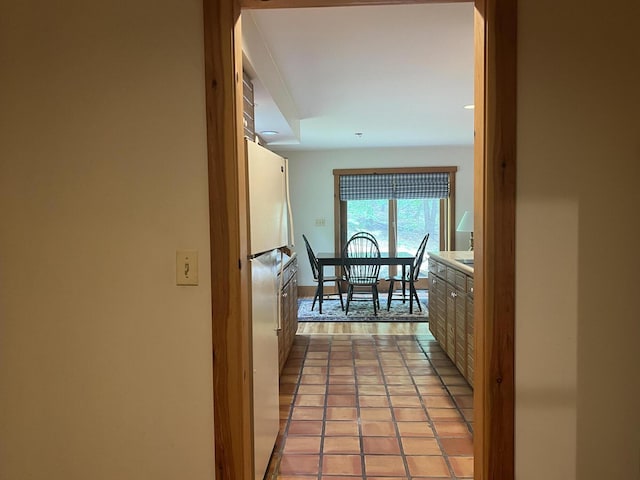 hallway featuring light tile patterned floors